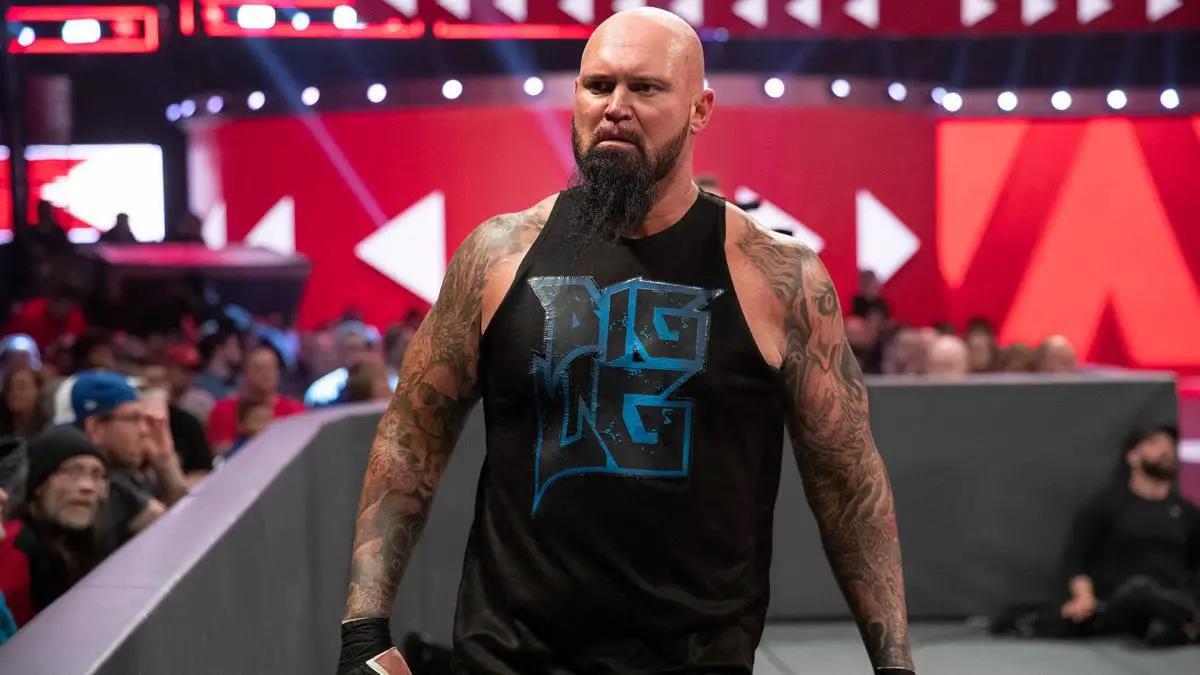 Luke Gallows in a black vest with 'Big LG' on the front