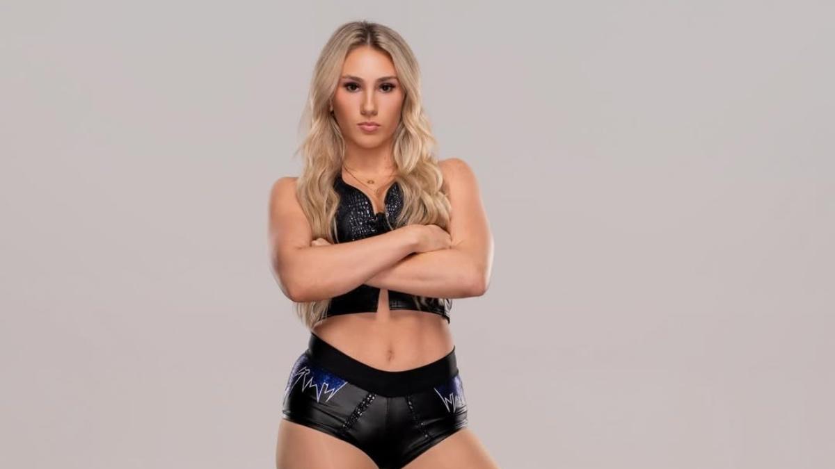 Marie Malenko in photoshoot with her arms folded