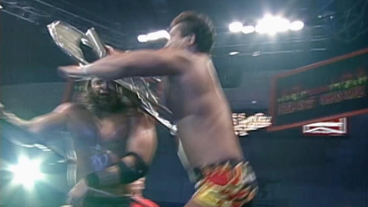 Masato Tanaka jumping with a steel chair into Mike Awesome's head at ECW Heat Wave 1998