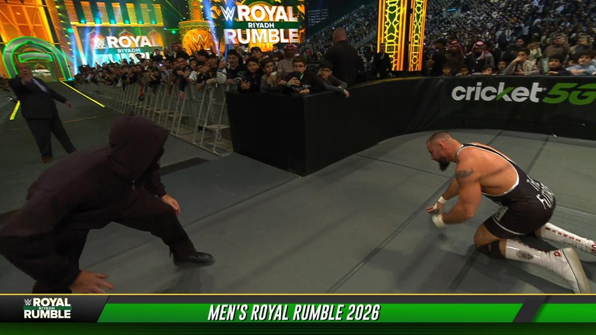 Masked man lining up to hit Bron Breakker with a stomp at WWE Royal Rumble 2026