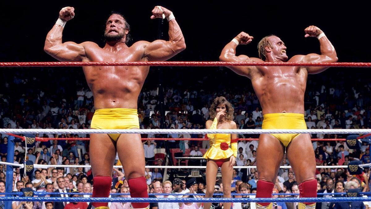 Mega Powers flexing with Miss Elizabeth behind them at WWE SummerSlam 1988
