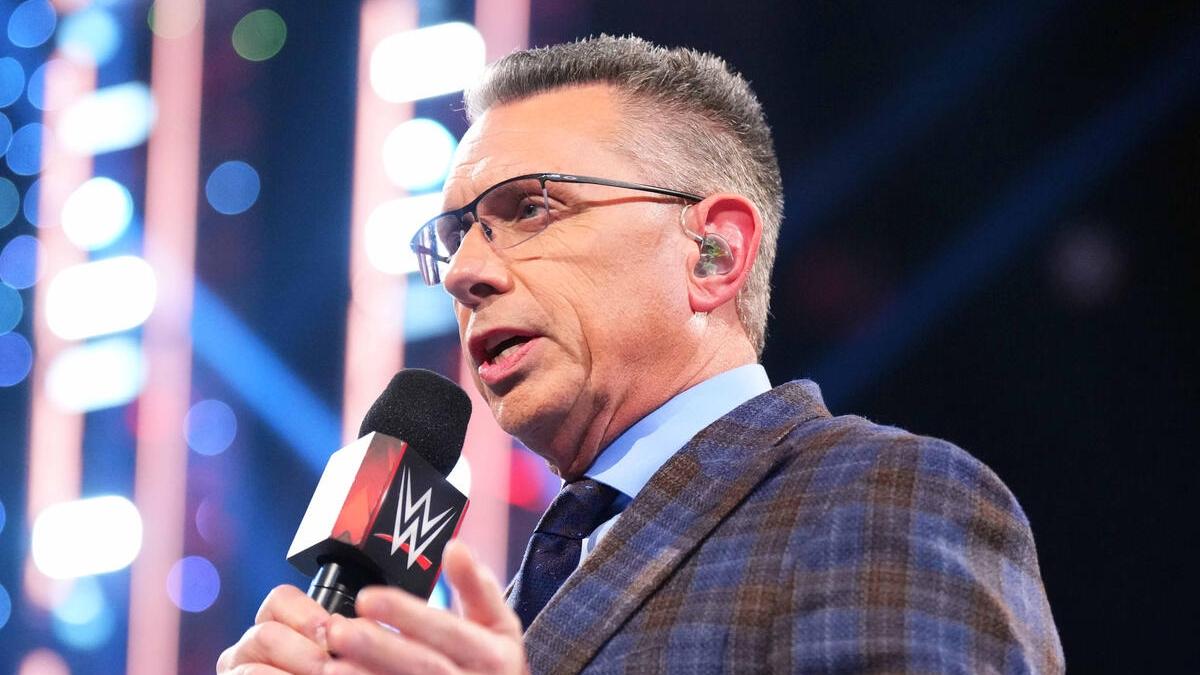 Michael Cole speaks into the microphone during an episode of WWE Raw