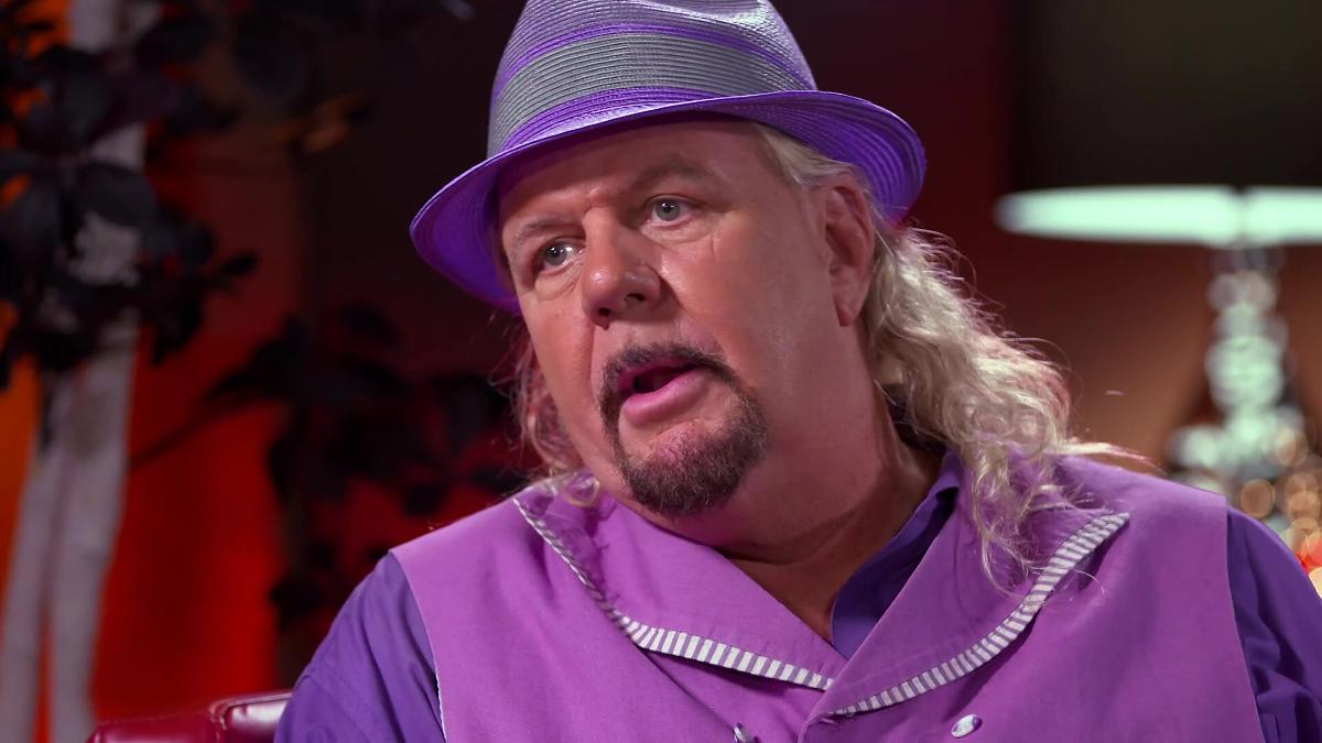 Michael hayes in all purple attire and purple hat