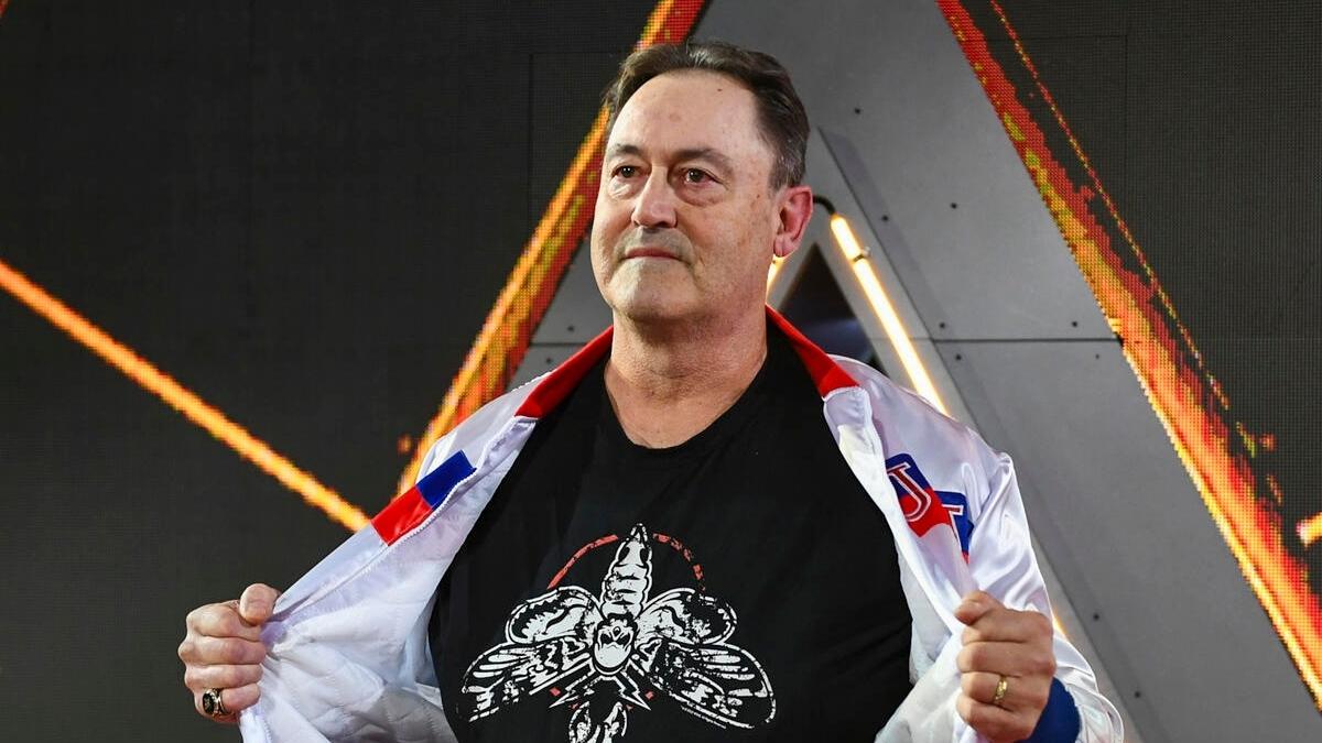 Mike Rotunda showing off a Bray Wyatt shirt at WWE WrestleMania 40
