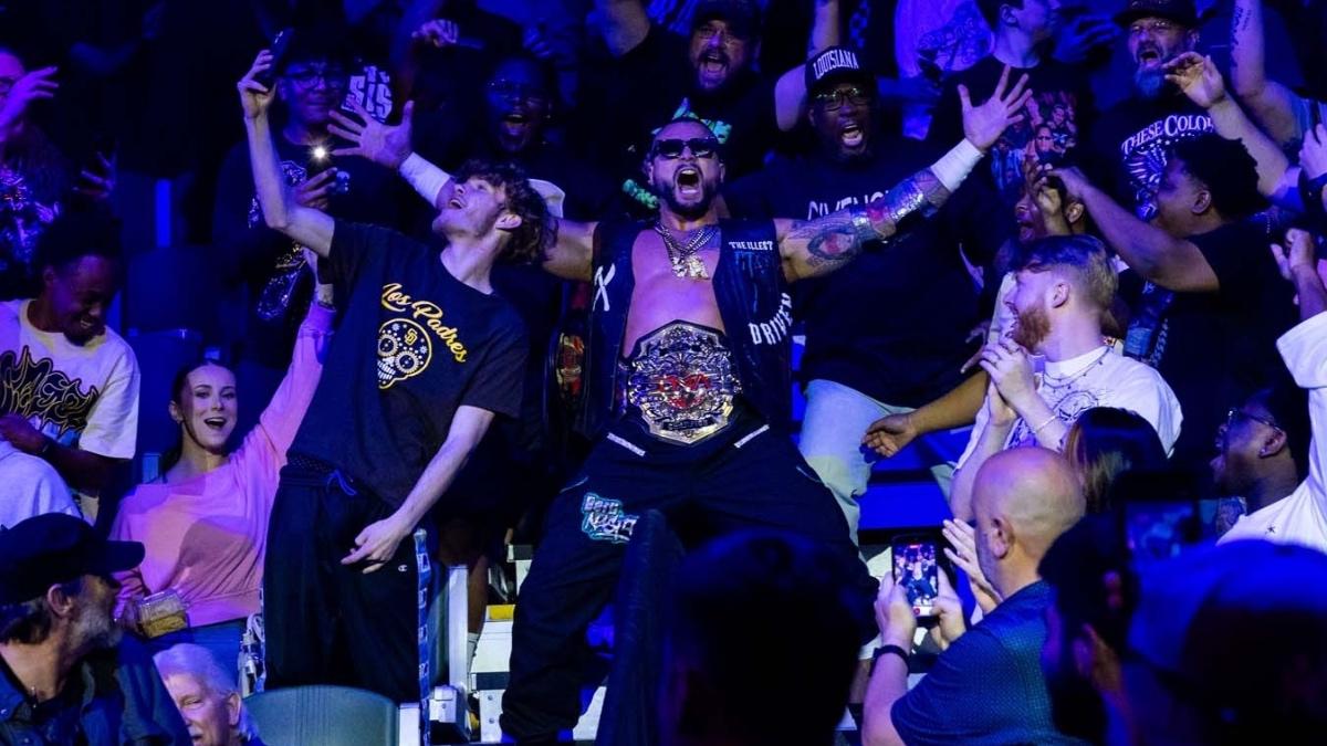 Mike Santana celebrating with the TNA crowd while making his entrance