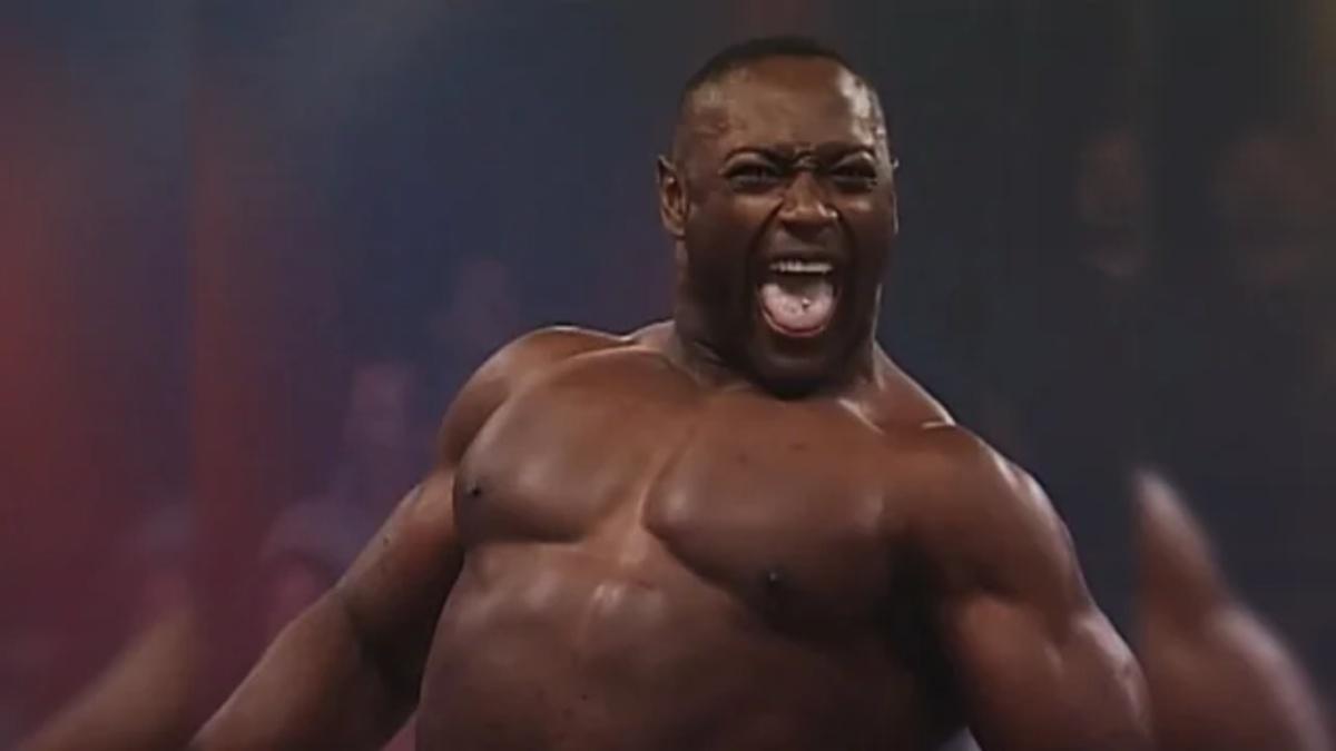 Monty Brown roaring in TNA in front of a blurred audience 