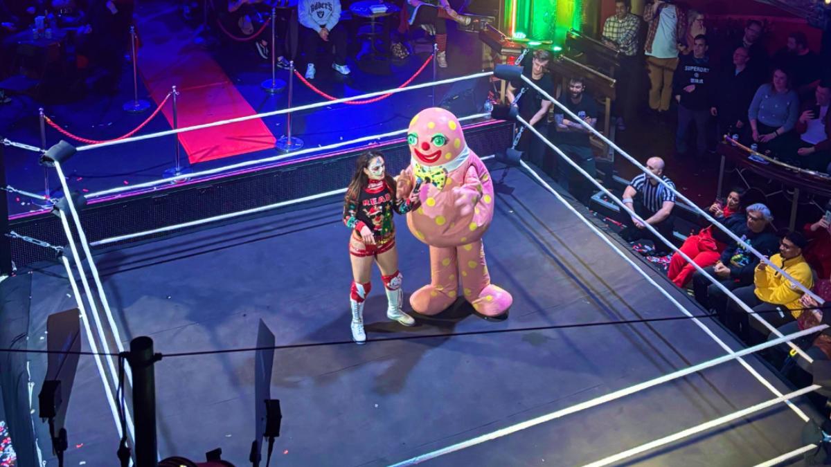 Mr Blobby in a pro wrestling ring with Thunder Rosa