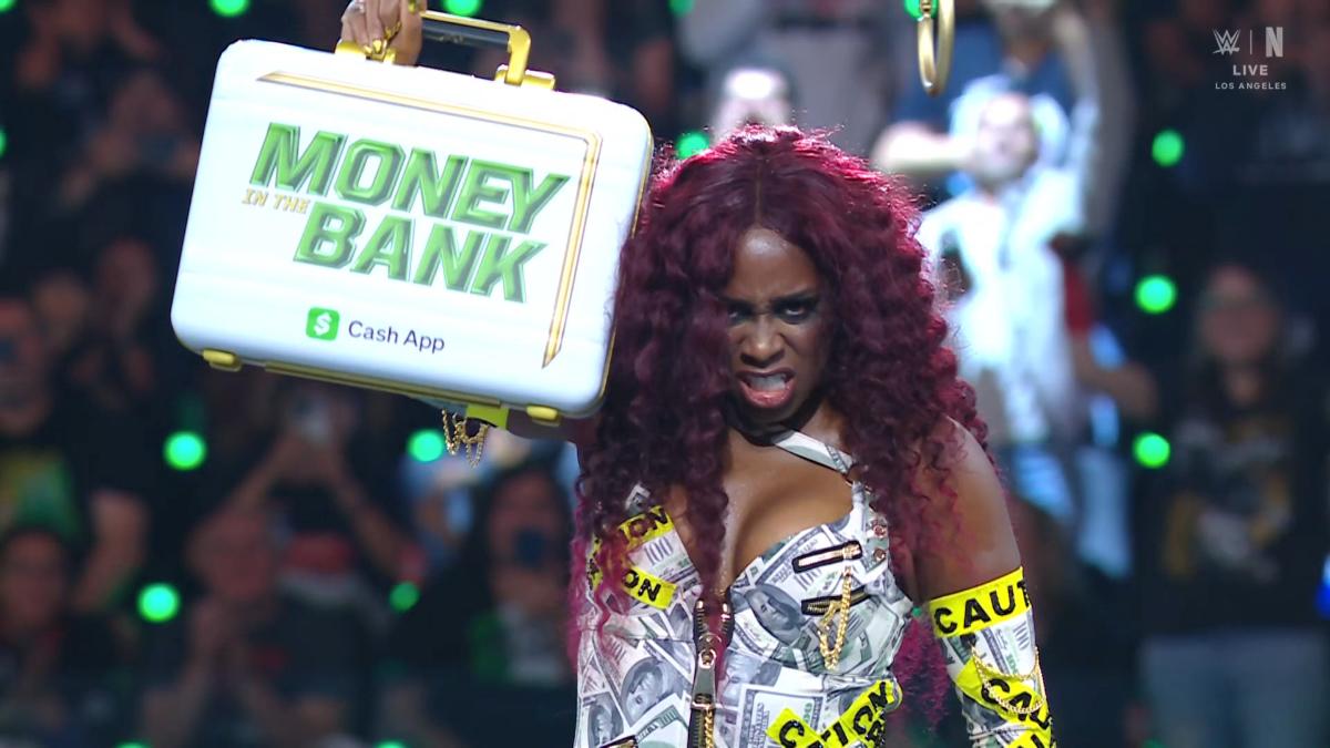 Naomi with the Money in the Bank briefcase