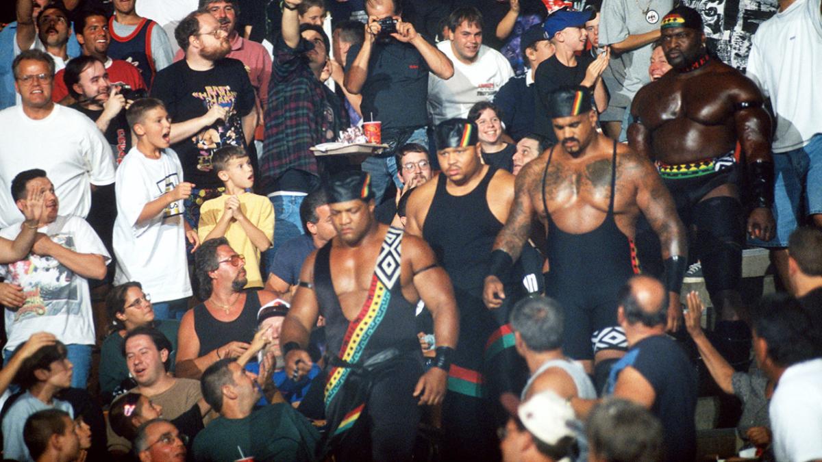 Nation of Domination (Faarooq, D-Lo Brown, The Godfather, and Ahmed Johnson) making their entrance through the WWE Crowd