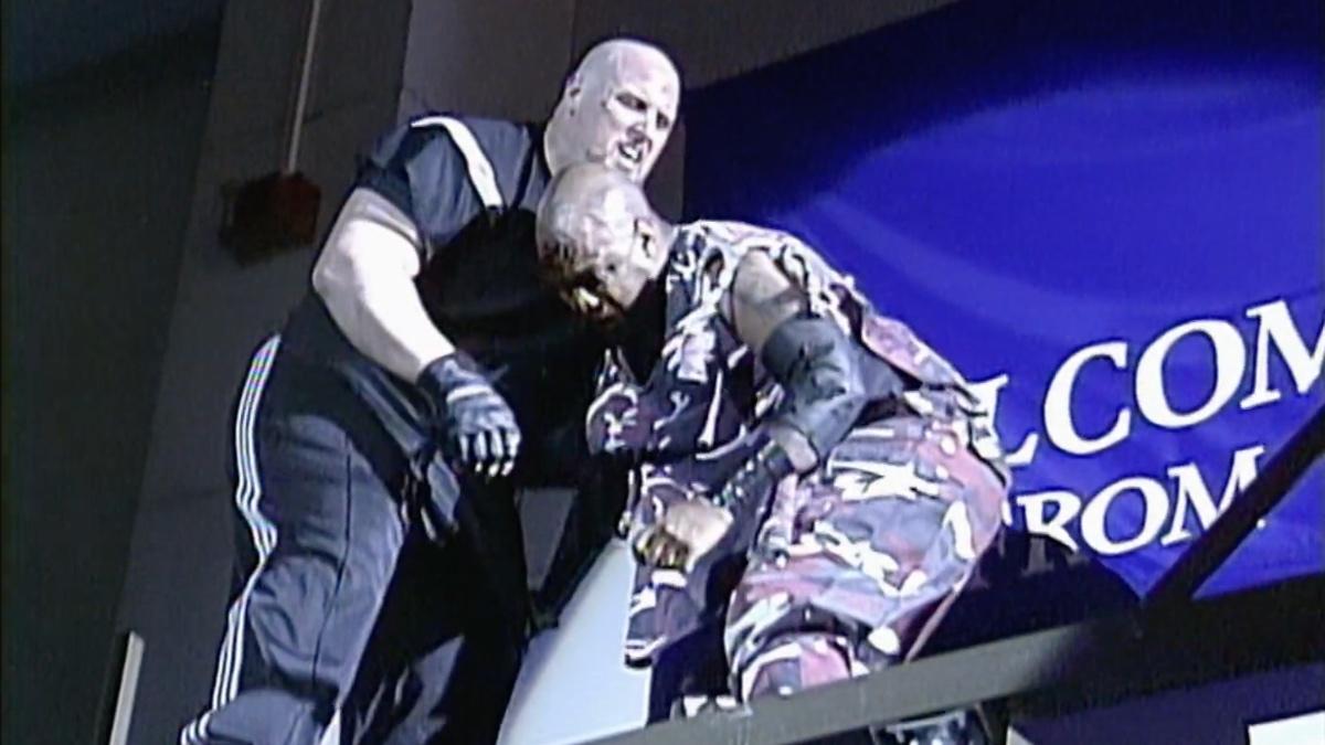 New Jack lying on Vic Grimes' chest on top of a scaffold