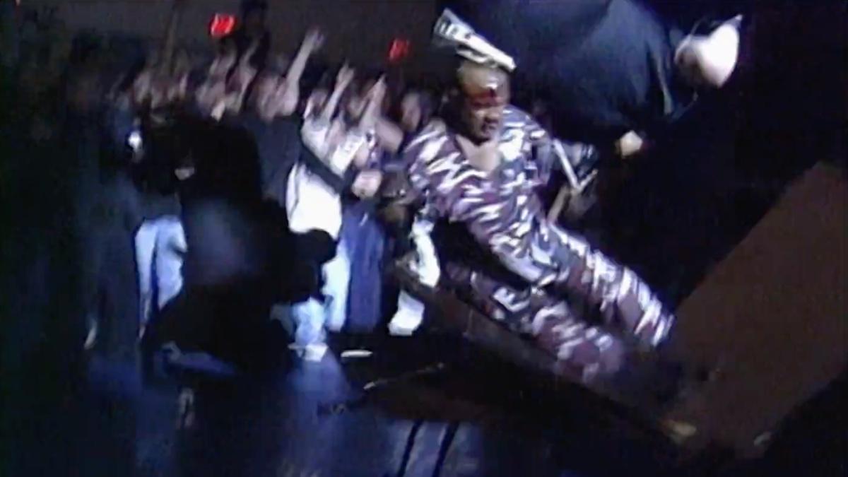 New Jack crashing through the table as Vic Grimes is above him in mid-air