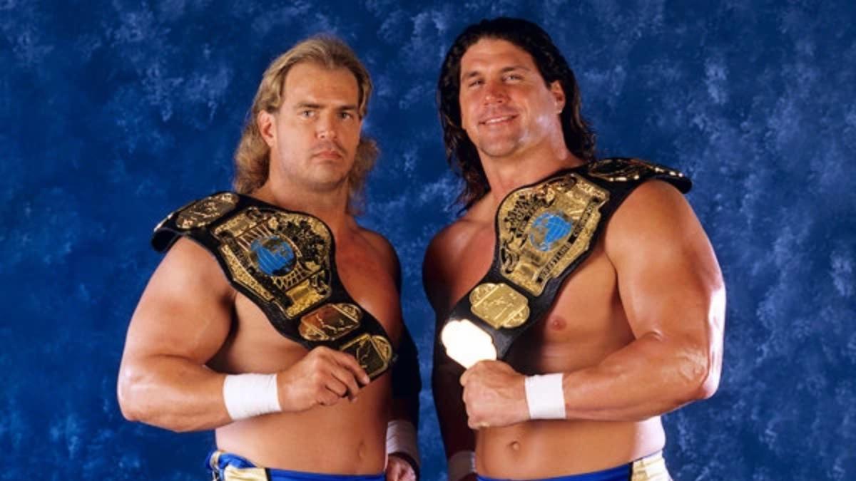 New Midnight Express posing with title belts