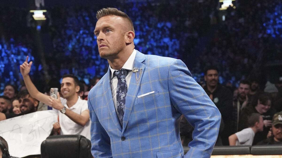 General Manager Nick Aldis observes the action from ringside during an episode of SmackDown in 2024