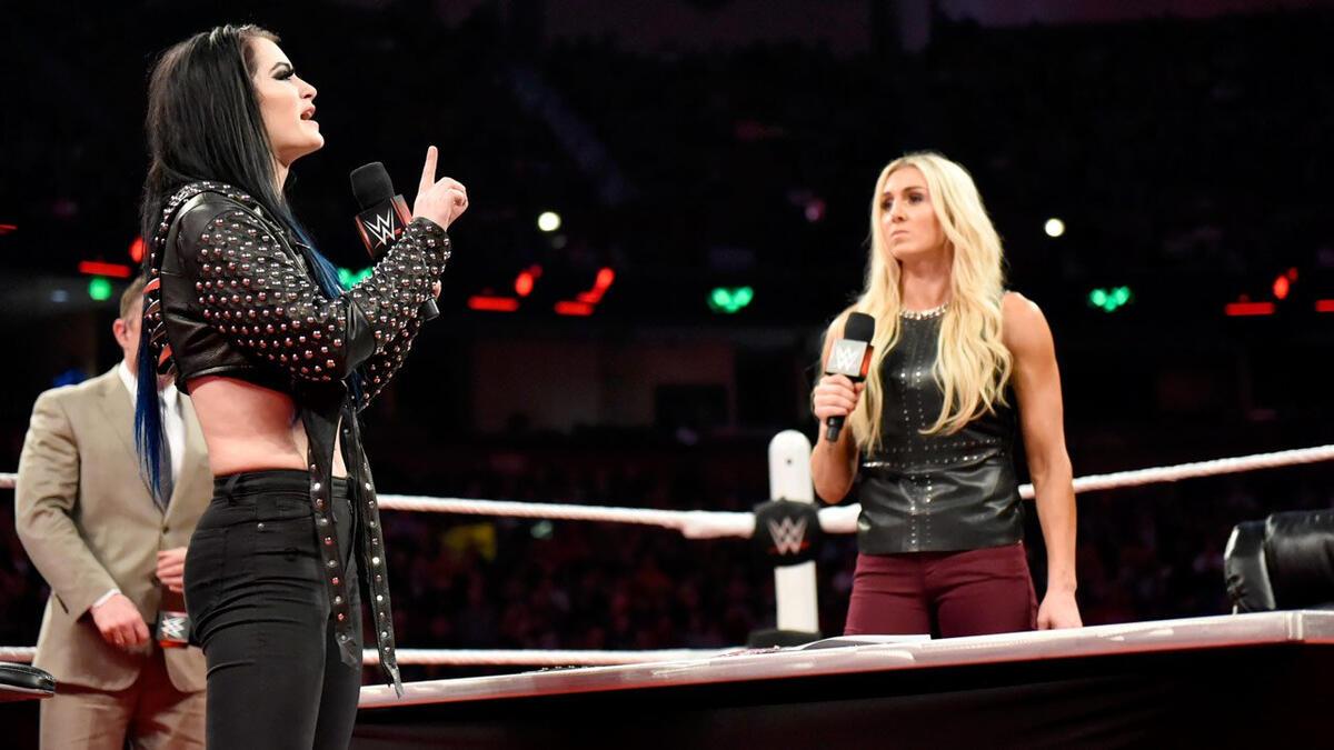 Paige cutting a promo with Charlotte Flair on a November 2015 episode of WWE RAW