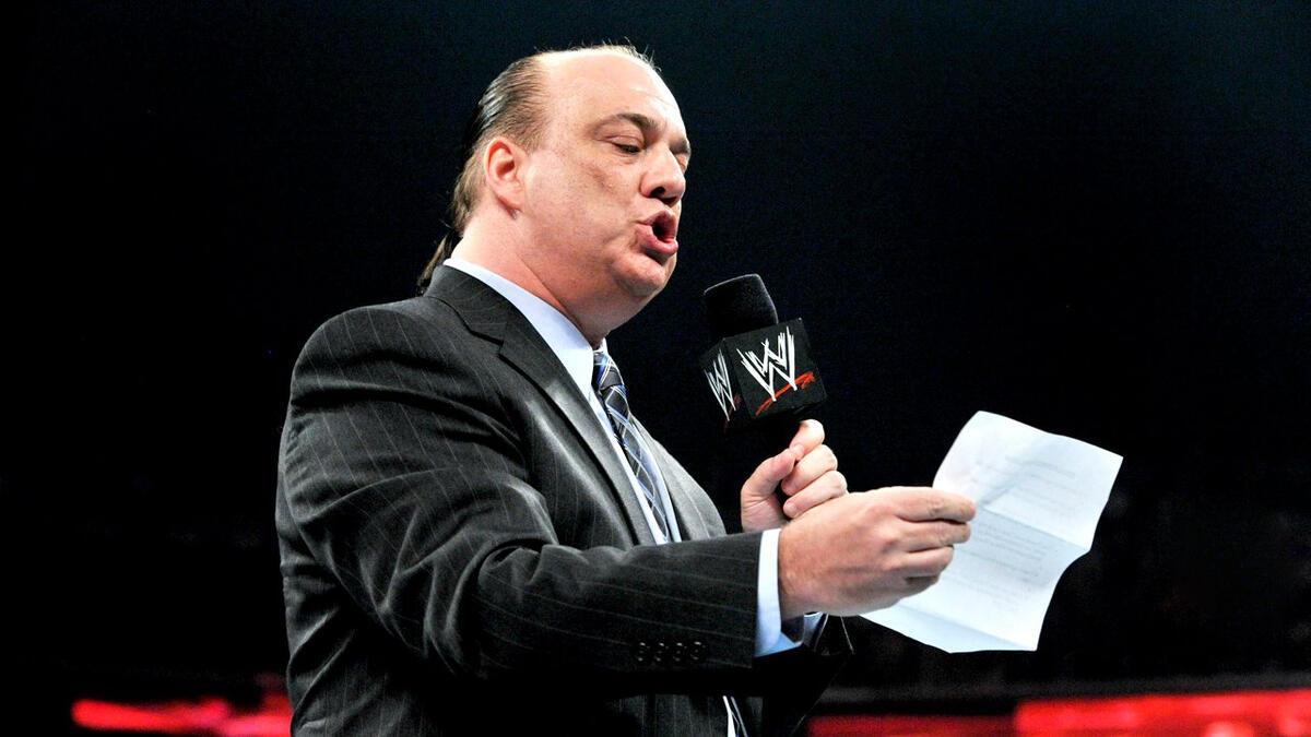 Paul Heyman reads from a piece of paper during an in-ring WWE Raw promo in 2012