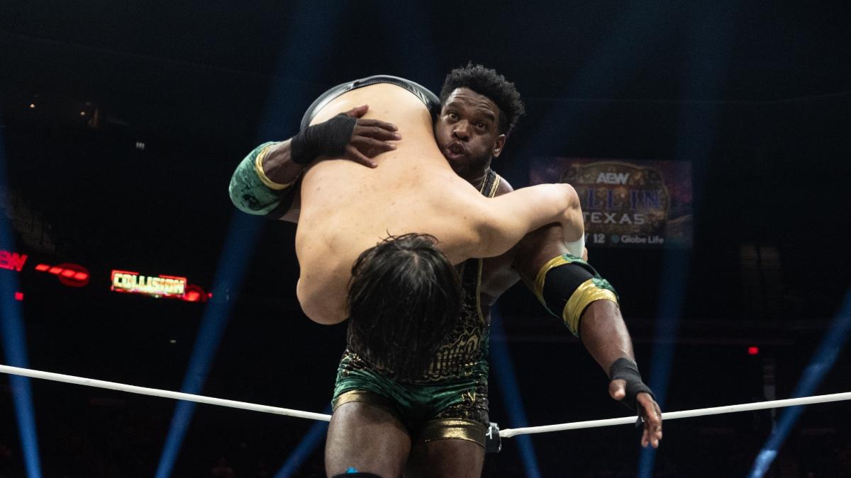 Powerhouse Hobbs holding Wheeler Yuta over his shoulders ready for a powerslam