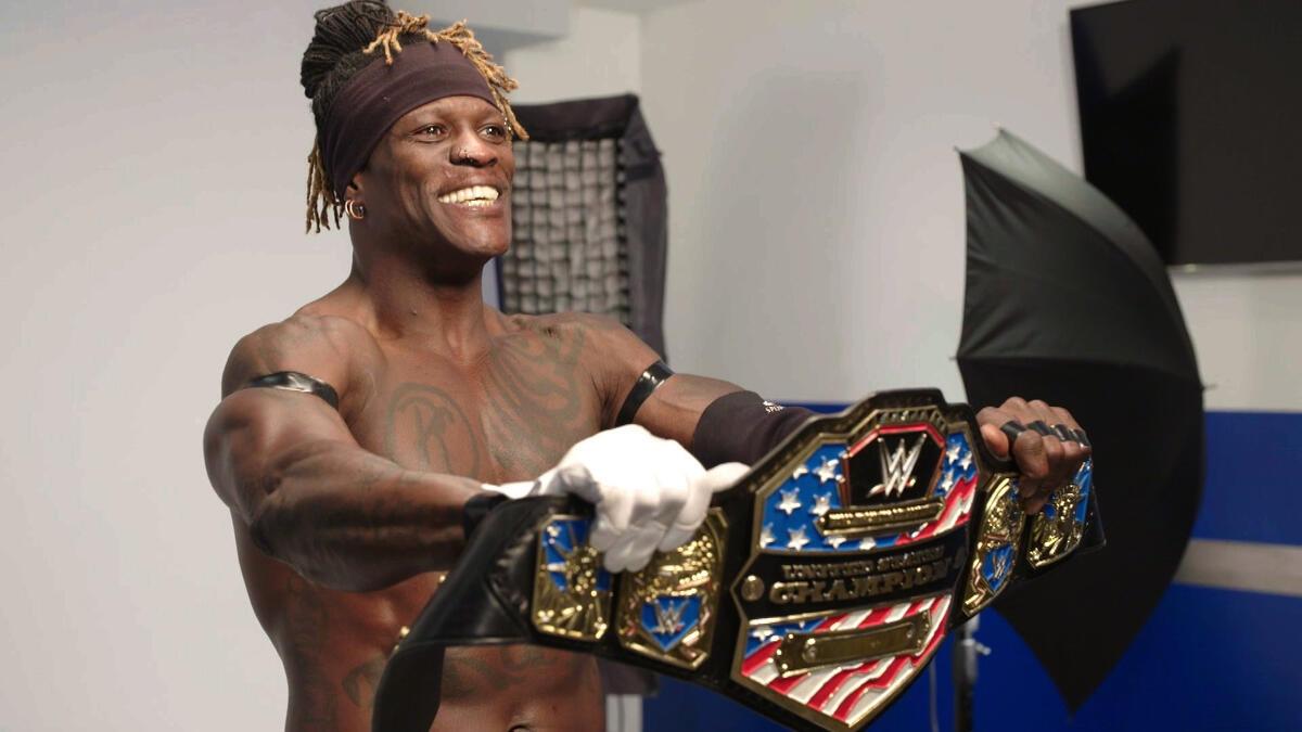 R-Truth posing with the WWE United States Title belt following his win in January 2019