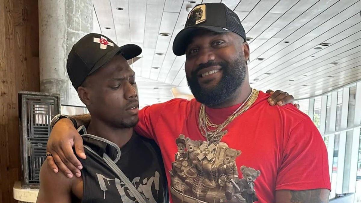 Rampage Jackson and Raja Jackson embracing for a photo