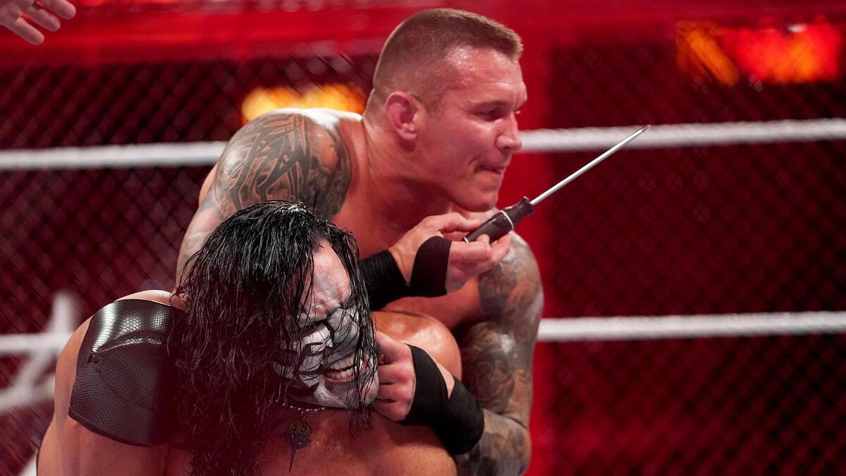 Randy Orton putting a screwdriver through Jeff Hardy's ear