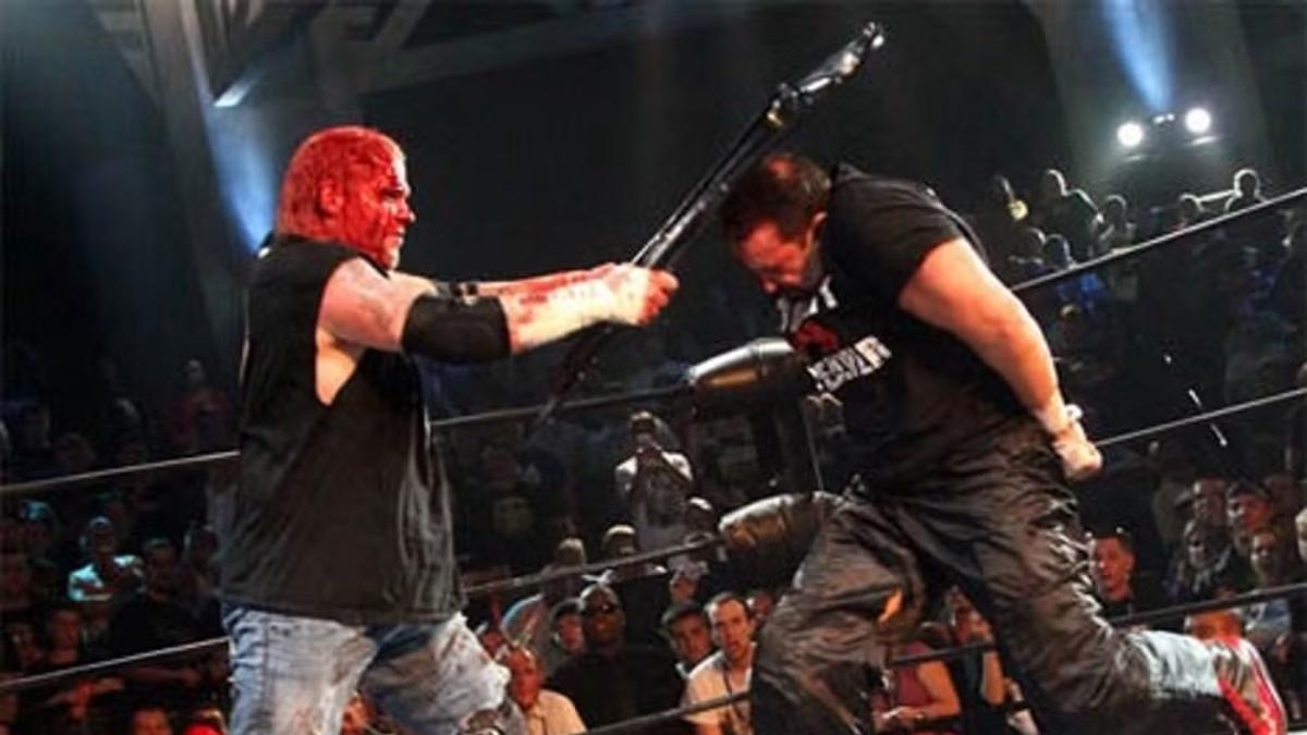 A bloodied Raven hitting Tommy Dreamer over the head with a steel chair