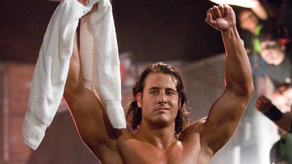 Rene Dupree holding a towel above his head on a 2006 episode of WWE ECW