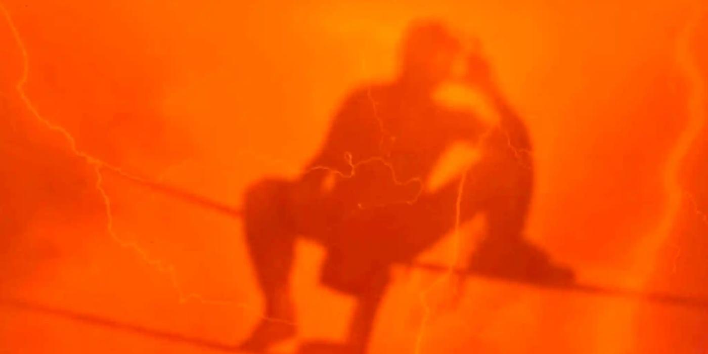 Silhouette of Rey Fenix with an orange haze 