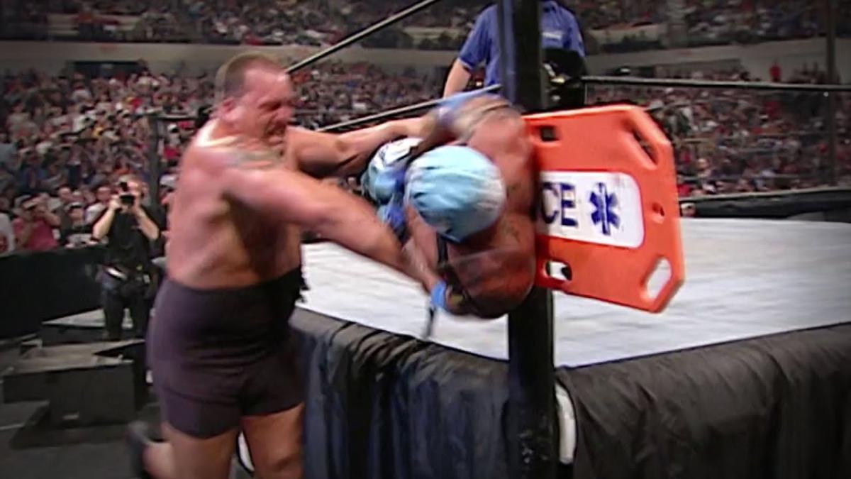 Rey Mysterio on a back board being thrown into a ring post by the Big Show at WWE Backlash 2003