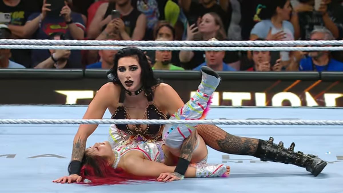 Rhea Ripley pinning IYO SKY while between her legs