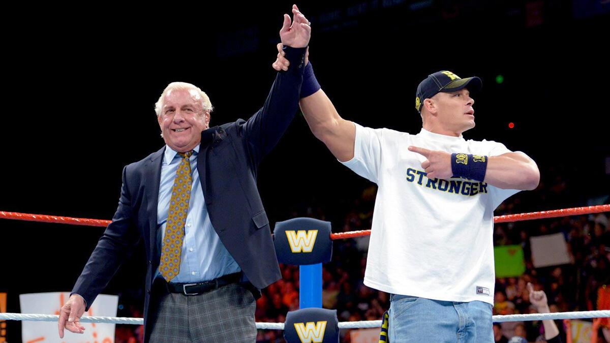 John Cena raises Ric Flair's hand during an 'old school' episode of WWE Raw in 2014