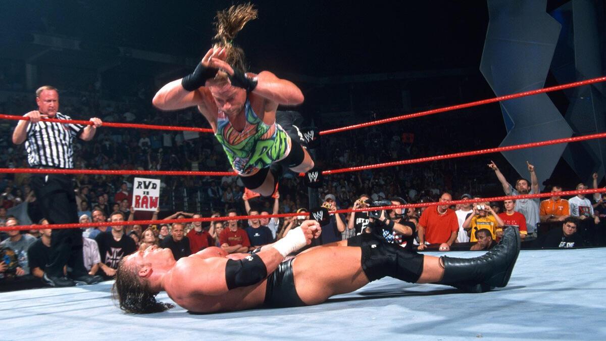 Rob Van Dam hits a Five-Star Frog Splash on Triple H during a match on WWE Raw in 2002