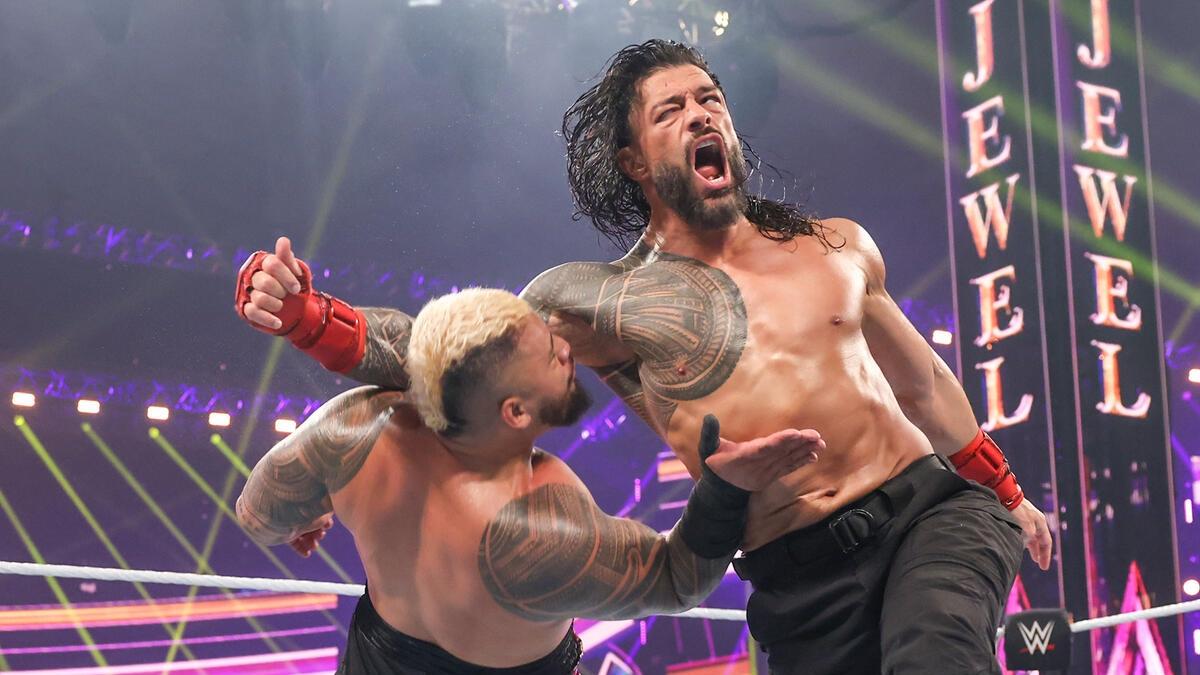 Roman Reigns hitting Solo Sikoa with a clothesline at WWE Crown Jewel 2024