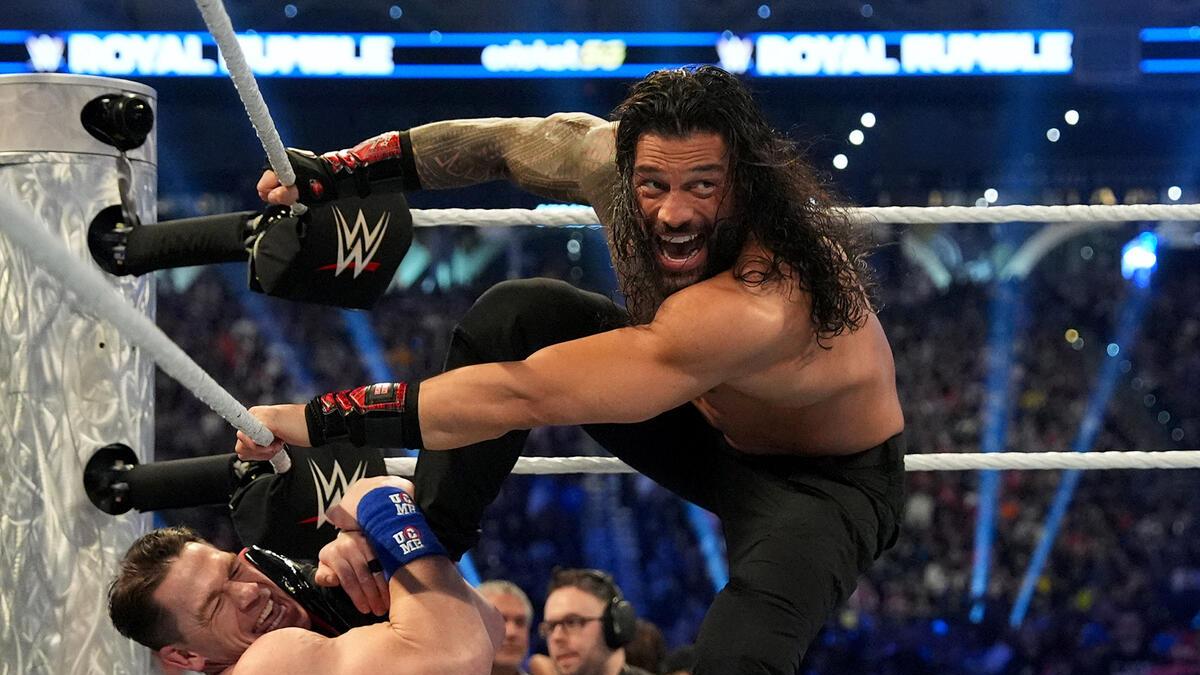 Roman Reigns with his foot on John Cena's face at WWE Royal Rumble 2025