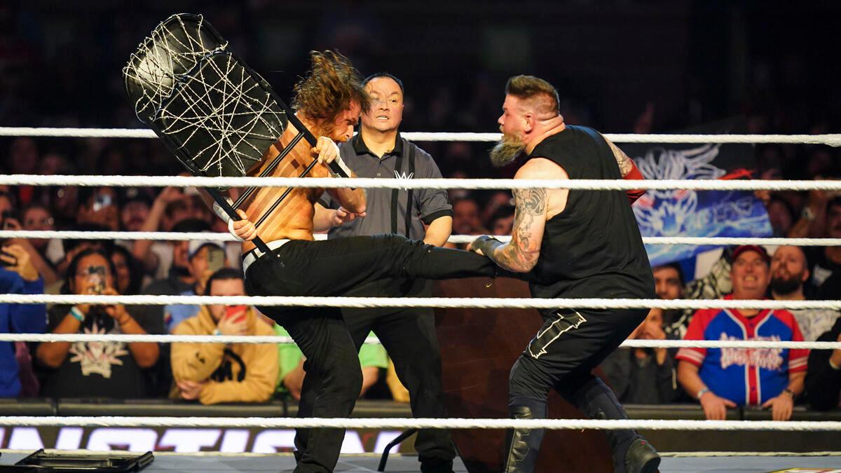 Kevin Owens and Sami Zayn using barbed wire chair at WWE Elimination Chamber 2025