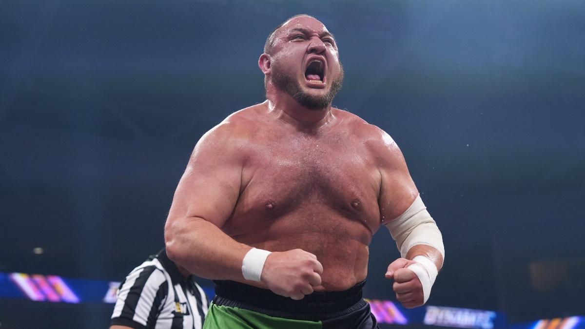 Samoa Joe flexing and shouting while topless