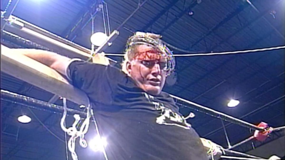 Close up of The Sandman strapped to the cross at ECW High Incident