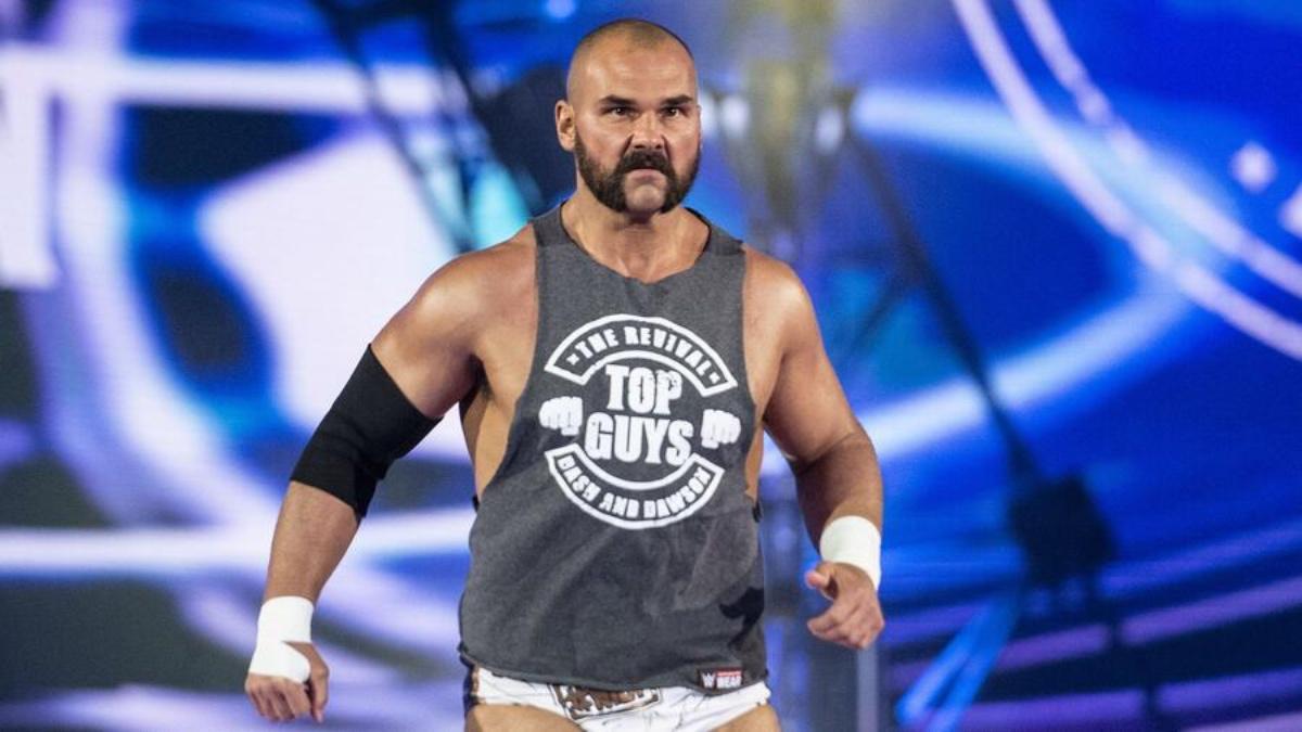 Scott Dawson waling to the ring with muttonchops and a grey vest