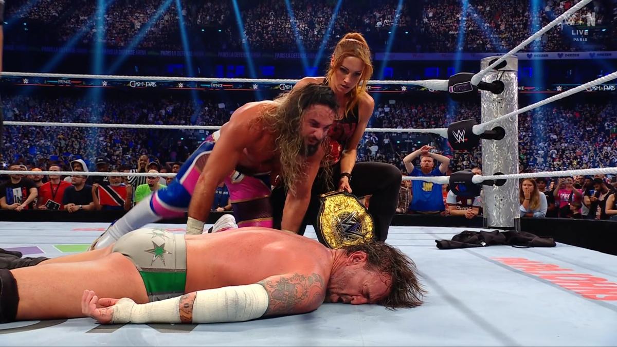 Seth Rollins and Becky Lynch laughing at CM Punk