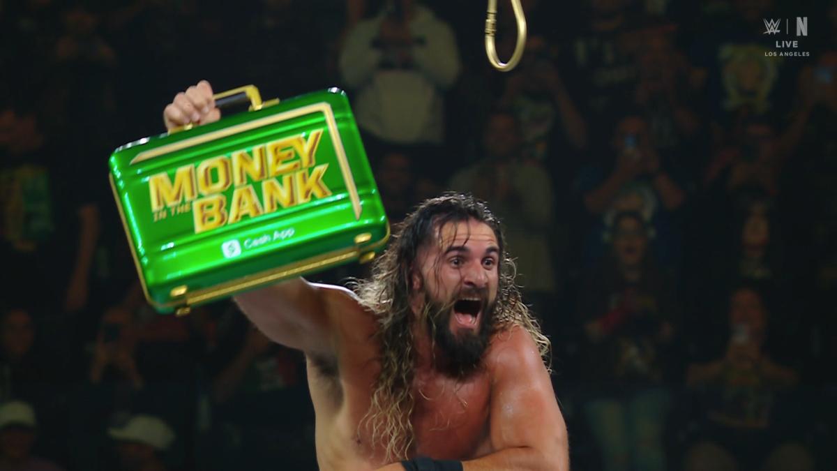 Seth Rollins holding the Money in the Bank briefcase