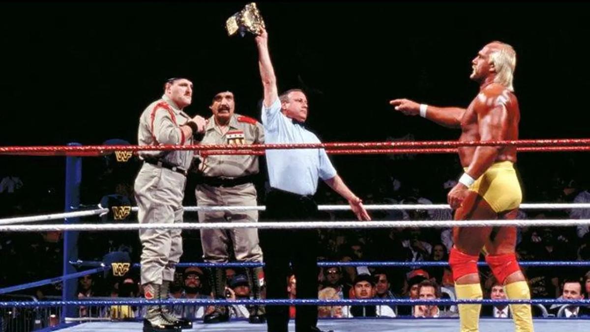 Sgt Slaughter standing across the ring from Hulk Hogan