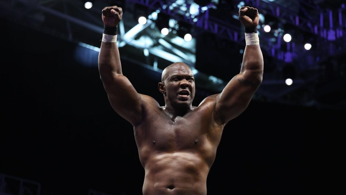 Shelton Benjamin stands with his arms raised in the air following a victory on AEW Dynamite