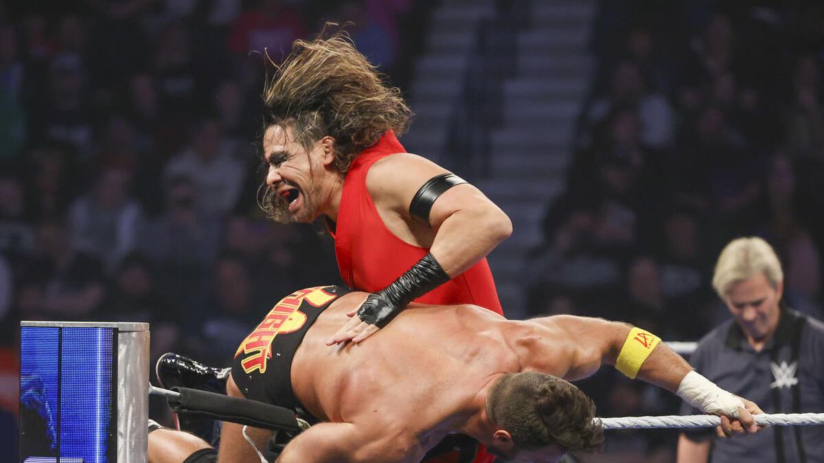 Shinsuke Nakamura hitting a knee to LA Knight