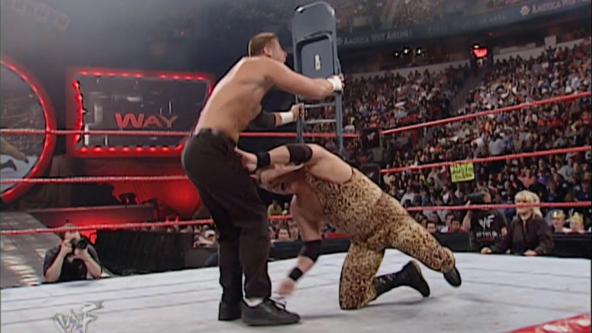 Jerry Lawler about to hit a low blow on Steven Richards, who is holding a steel chair