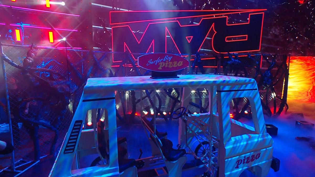 Stranger Things' Surfer Boy Pizza van sitting in front of the Raw logo upside down
