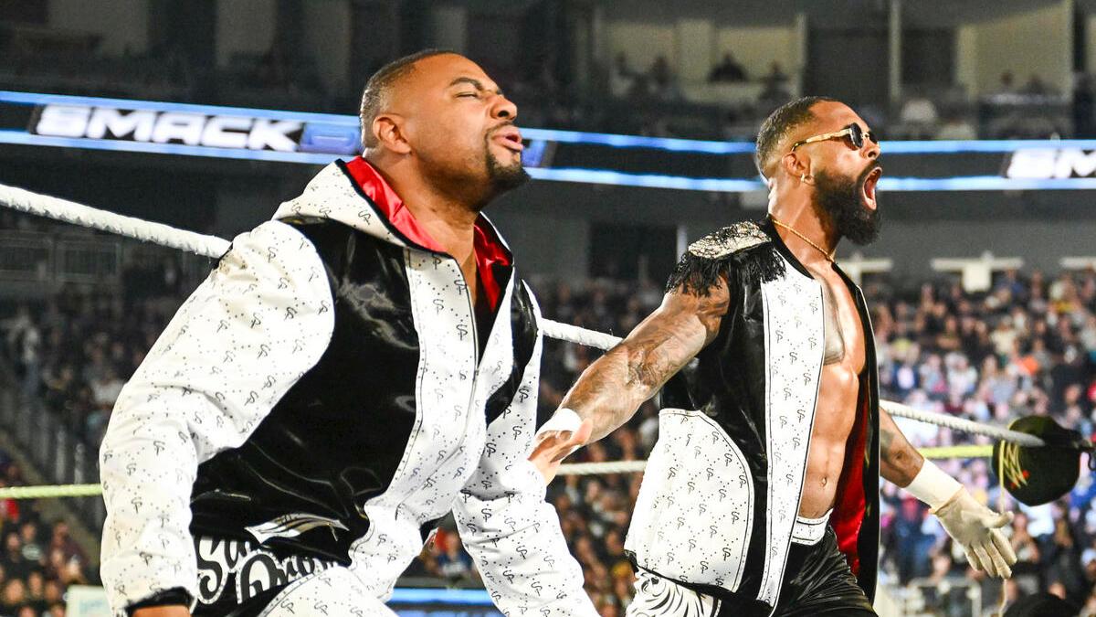 Street Profits on the ring apron during their entrance on a November 2024 episode of WWE SmackDown