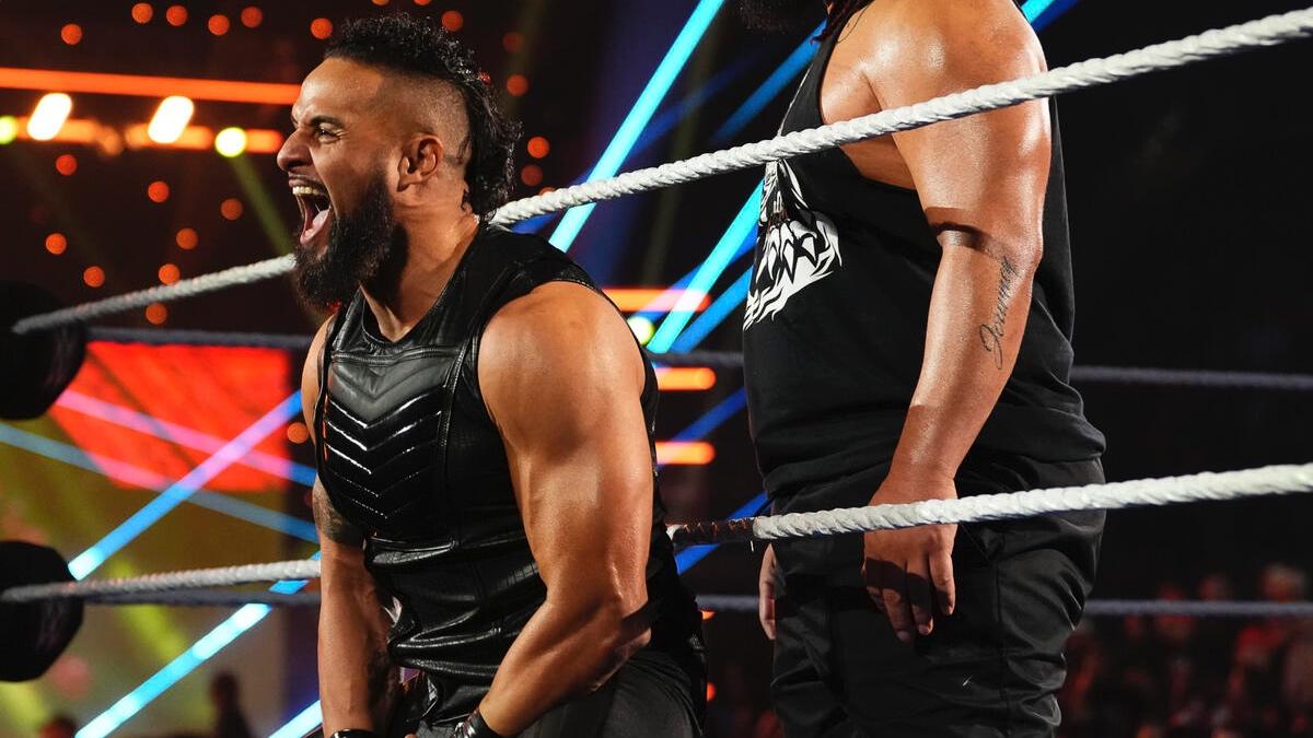 Tama Tonga laughing on the ring apron