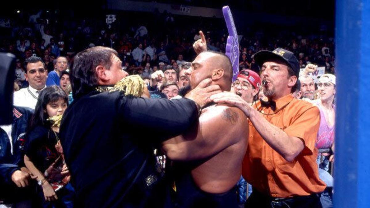 Taz grappling with Jerry Lawler on WWE Raw in 1997