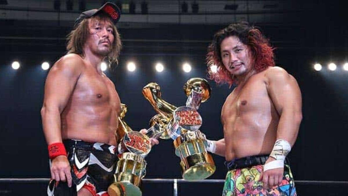 Tetsuya Naito and Hiromu Takahashi in the ring with trophies