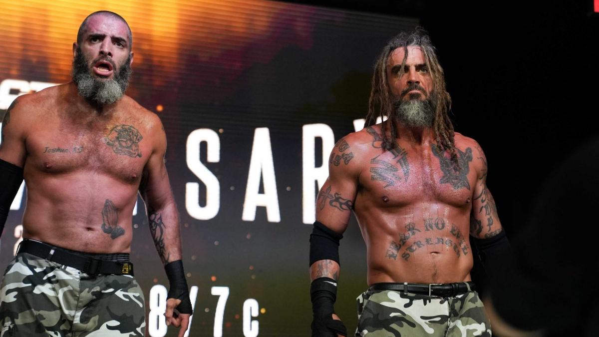 Jay and Mark Briscoe stand on the ramp following a match for IMPACT Wrestling in 2022.