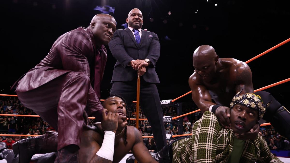 Bobby Lashley and Shelton Benjamin subdue Swerve Strickland and Prince Nana as MVP looks on approvingly