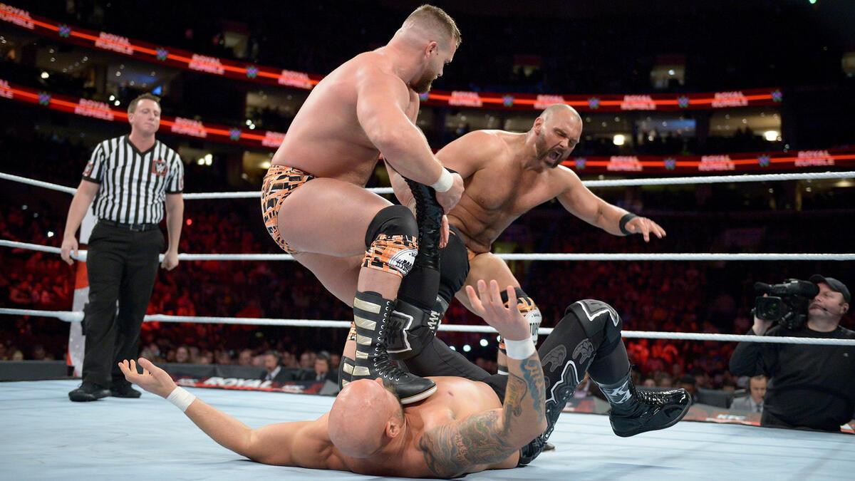 The Revival kicking Karl Anderson at WWE Royal Rumble 2018